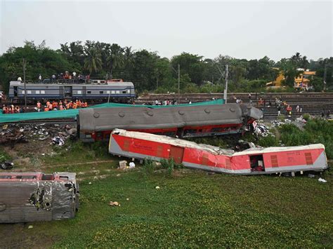 As India grieves train crash that killed 275, relatives try to identify bodies of loved ones